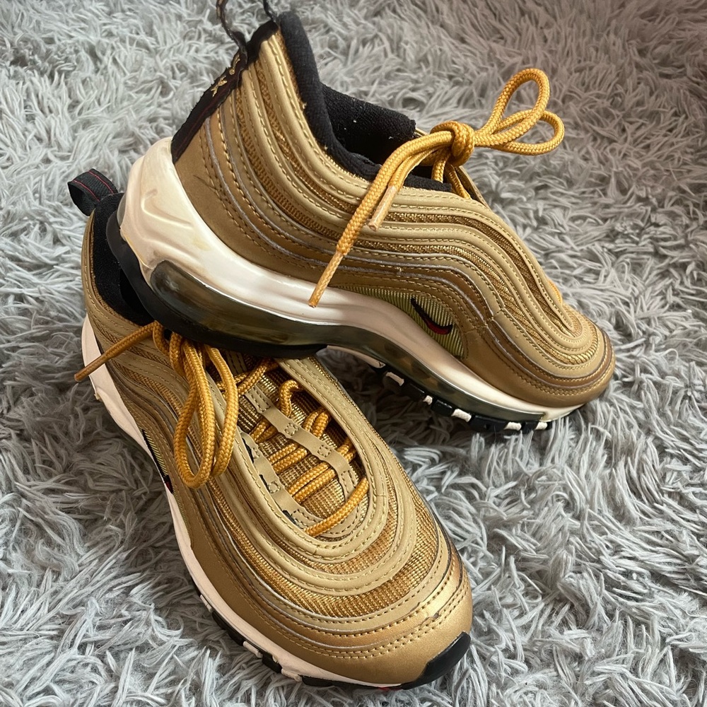 Gold Airmax 97’s woman